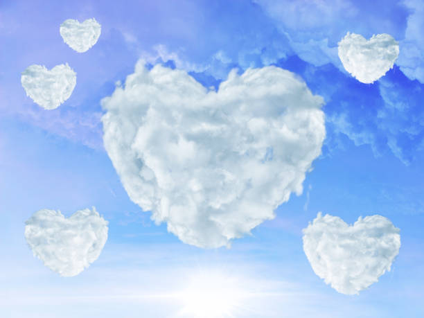 istock blue sky with clouds shaped as heart. Love concept 669214124