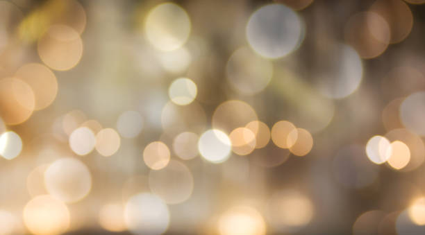 istock Romantic dreamy golden orange bokeh and white light background 669217250