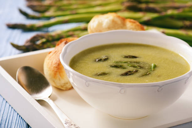 istock Asparagus cream soup on wooden tray. 669217770