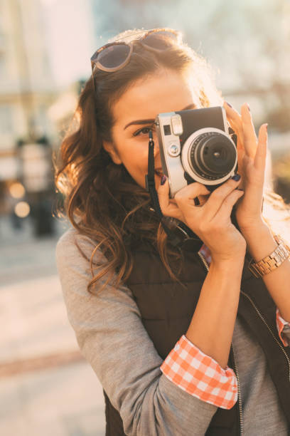 istock Young female photographer 669220276