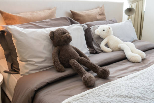 istock kids room with dolls and pillows on bed at home 669226738