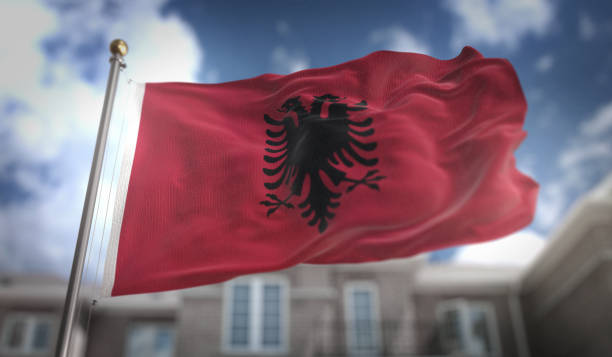 istock Albania Flag 3D Rendering on Blue Sky Building Background 669226840