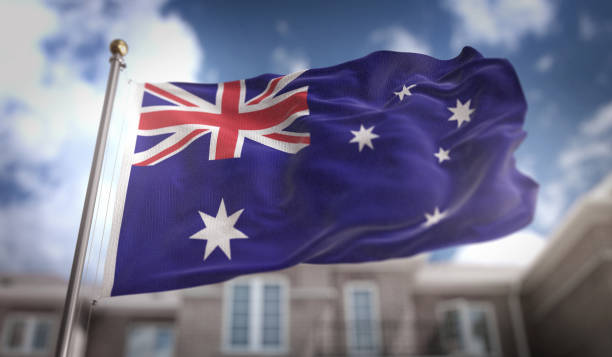 istock Australia Flag 3D Rendering on Blue Sky Building Background 669227238