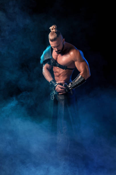 istock Young and muscular man performing a theatrical pose on  stag 669227334