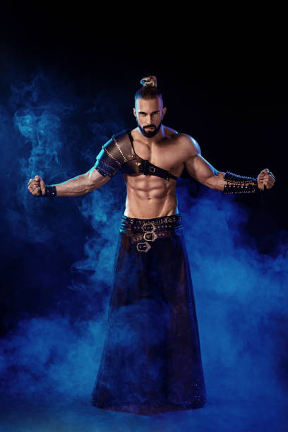 istock Young and muscular man performing a theatrical pose on stage 669227546