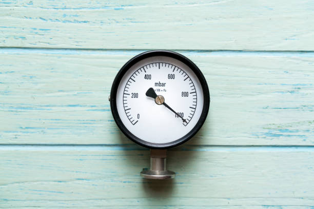 istock pressure gauge on wood background 669244472