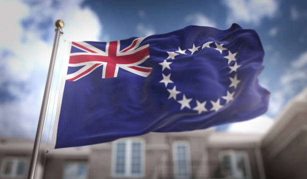 istock Cook Islands Flag 3D Rendering on Blue Sky Building Background 669247282