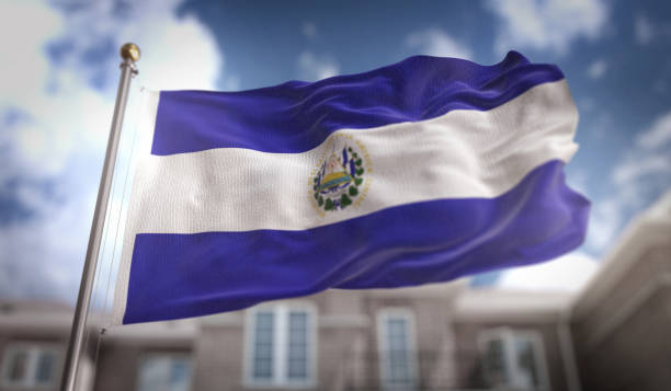 el salvador flag 3d rendering on blue sky building background - salvadoran flag imagens e fotografias de stock