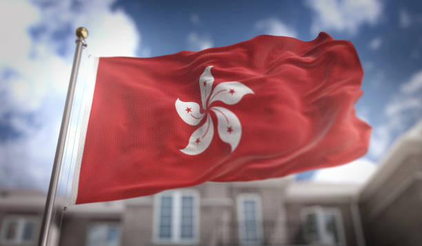 istock Hong Kong Flag 3D Rendering on Blue Sky Building Background 669250334