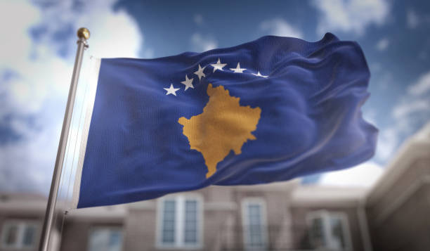 Kosovo Flag 3D Rendering on Blue Sky Building Background