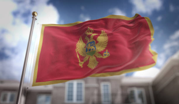 istock Montenegro Flag 3D Rendering on Blue Sky Building Background 669251252