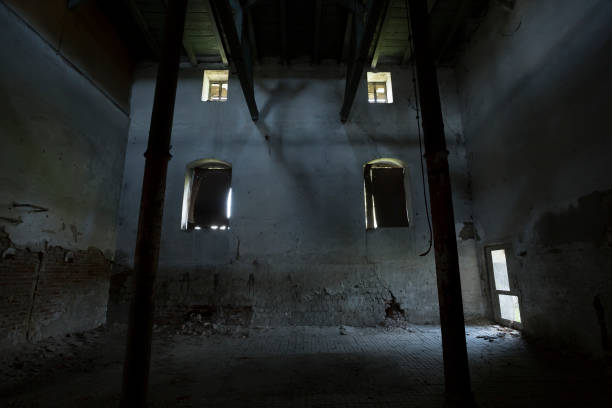 istock Dark, old abandoned building interior, with blocked windows 669254154