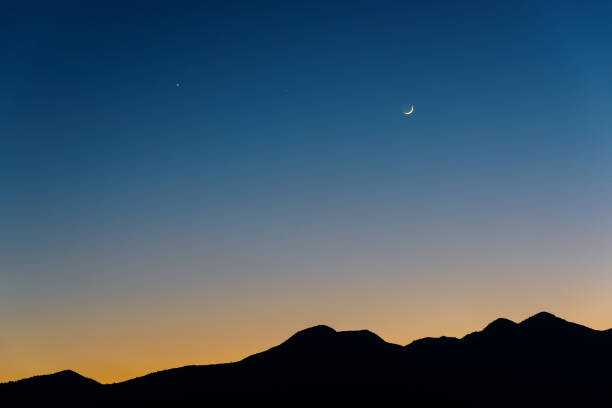 istock The Moon, Venus and Saturn after sunset 669254326
