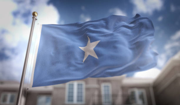 istock Somalia Flag 3D Rendering on Blue Sky Building Background 669256936