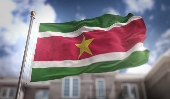 Suriname Flag 3D Rendering on Blue Sky Building Background