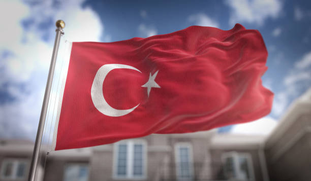 istock Turkey Flag 3D Rendering on Blue Sky Building Background 669257440