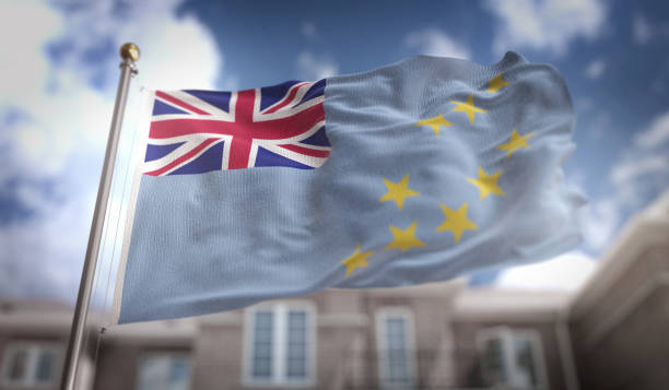 istock Tuvalu Flag 3D Rendering on Blue Sky Building Background 669257490