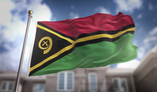 istock Vanuatu Flag 3D Rendering on Blue Sky Building Background 669259586
