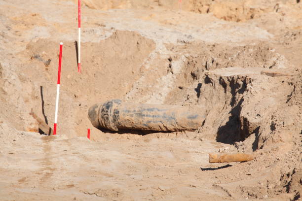 Pipe in the sand on a construction site, road construction work Pipe in the sand on a construction site, road construction work erde stock pictures, royalty-free photos & images