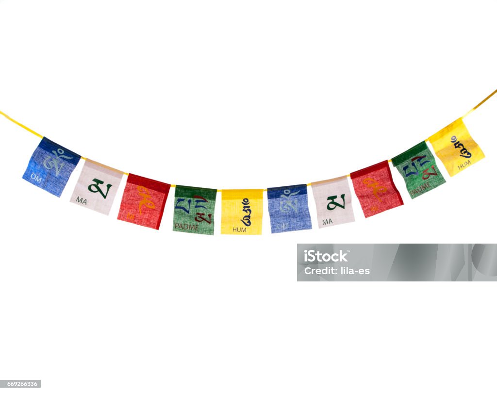 Buddhist prayer flag In the Tibetan Himalayas where they are hung on the mountain passes and mountain peaks for the wind to recite the mantras printed on them. Prayer Flag Stock Photo