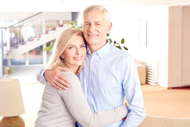 istock Charming couple embracing eachother at their home 669270330