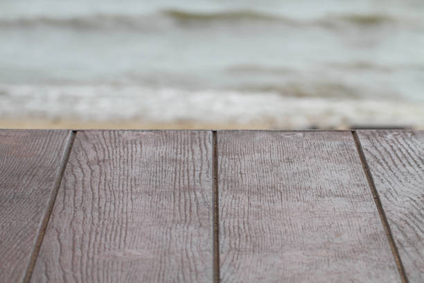 istock empty brown wooden texture table for restaurant, website, picture frame advertising chart board with sea nature backgrounds 669288482