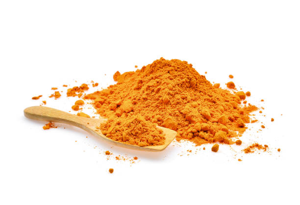 istock turmeric powder in wooden spoon isolated on white background 669294036