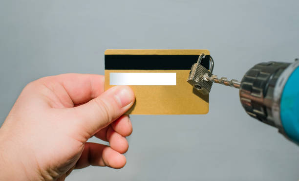 istock Credit card with hanging padlock 669302316