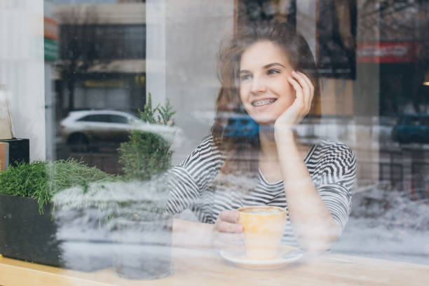 istock Girl drinking coffee in a coffee shop 669307320