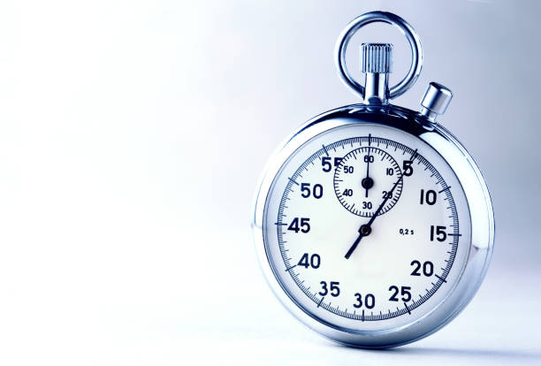 istock Stopwatch closeup on beige background 669312884