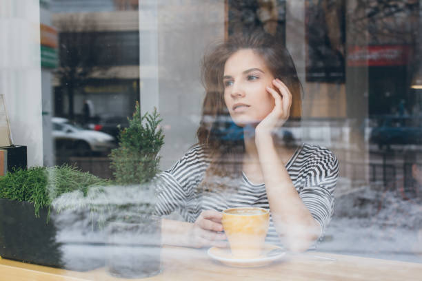 istock Girl drinking coffee in a coffee shop 669312976