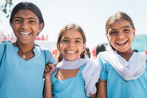 Sabalpura, Rajasthan, India: 15. March 2014: Happy smiling and laughing school girls in the streets of Sabalpura, Rajasthan, India. Real People Editorial Portraits.