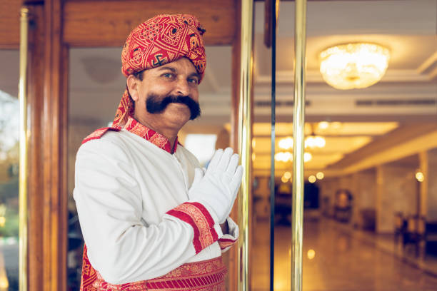 Indian Concierge Welcome Guest at Hotel Entrance Agra India Indian Concierge Welcome Guest at Hotel Entrance India. Agra, India. hotels stock pictures, royalty-free photos & images