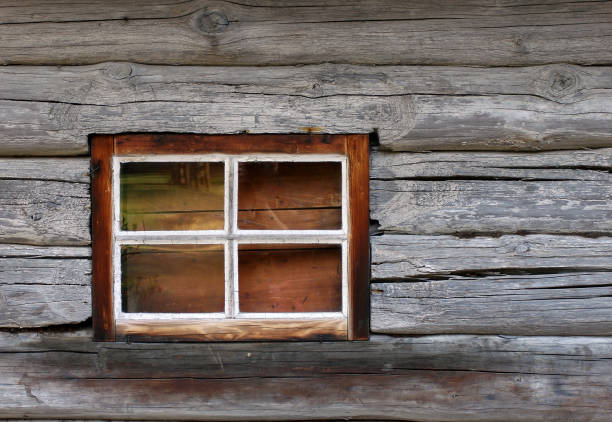 istock The old window in the wooden gouse wall 669330436