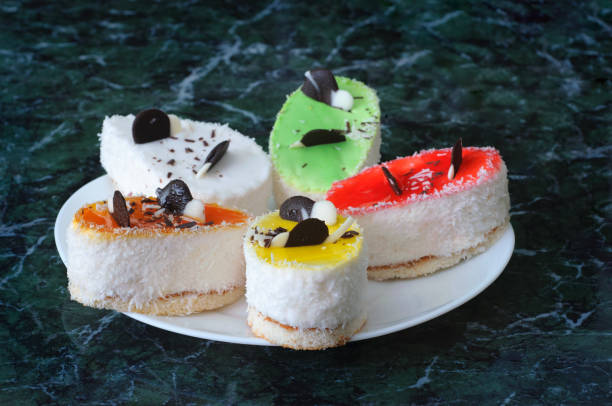 istock Colorful pastry cakes with chocolate on grunge background, selective focus 669333120