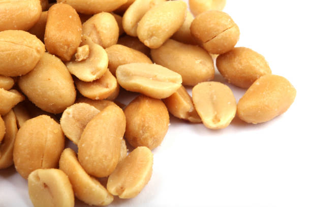 istock Close up of fried, peeled and salted peanuts 669335688