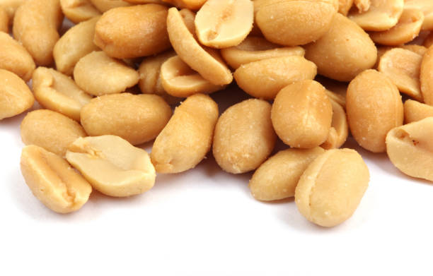 istock Close up of fried, peeled and salted peanuts 669335692