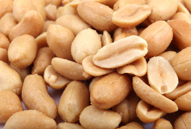 istock Close up of fried, peeled and salted peanuts 669335706