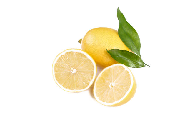 istock Lemon with leaves . Fruit and half isolated on white background. 669335758