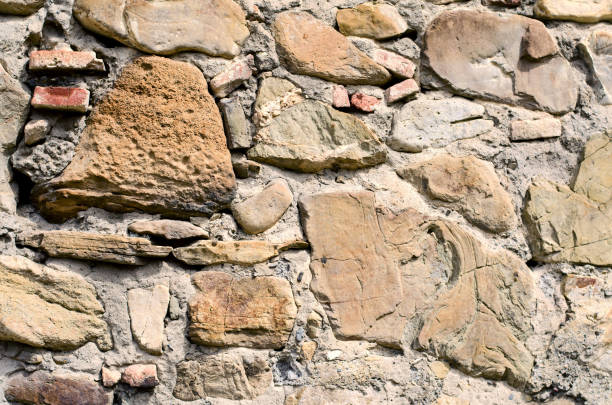 istock The texture of old stones together with cement. 669335942
