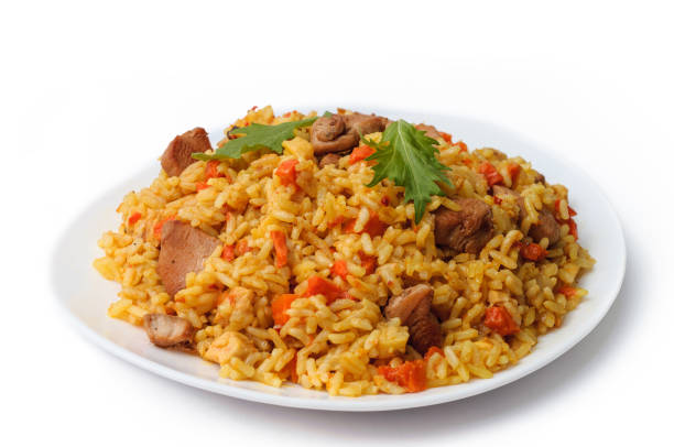 istock rice pilaf with meat carrot and onion isolated on white background. 669338824