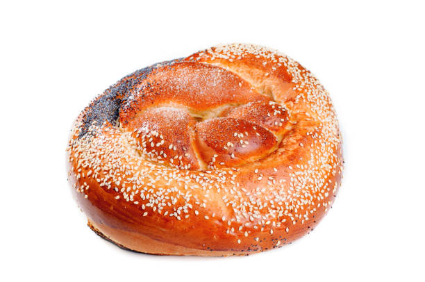 istock Freshly baked easter cake with poppy and sesame seeds on white background isolated 669340180