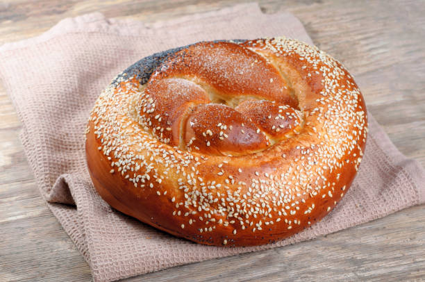 istock Fresh easter cake with poppy seeds and sesame seeds on a old wooden table 669340188