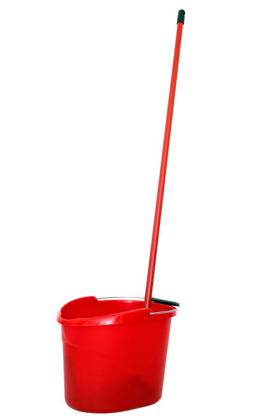 istock Red plastic bucket and mop isolated on white. 669346144