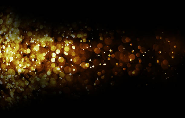 istock Bokeh light gold color black background 669346522