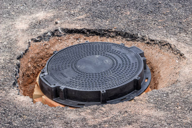 istock New round Iron manhole cover on the road 669349110
