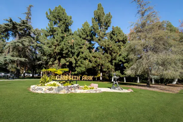 LOS ANGELES, USA - January 07, 2017:  Griffith Park sign and bear statue - Los Angeles, California, USA