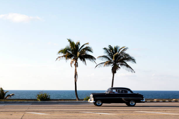 istock Classic car driving along the coast in Cuba 669353734