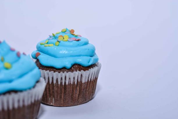 istock Pastry: Cupcake Isolated With Blue Frosting 669363082