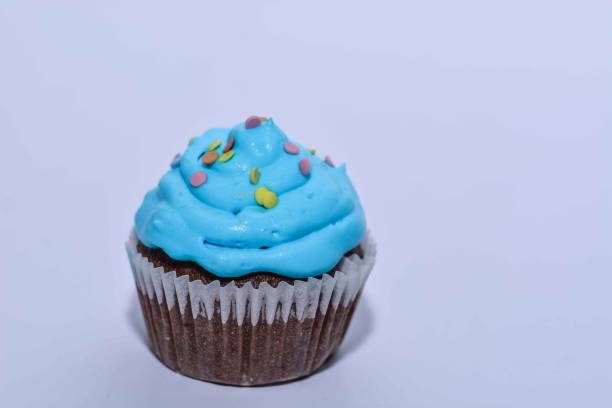 istock Pastry: Cupcake Isolated With Blue Frosting 669363084